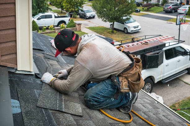 Professional Roofing technician working in Wainscott, NY
